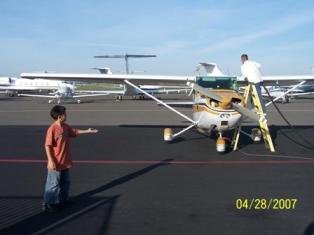 Tim showing how to refuel a Cessna after a flight.